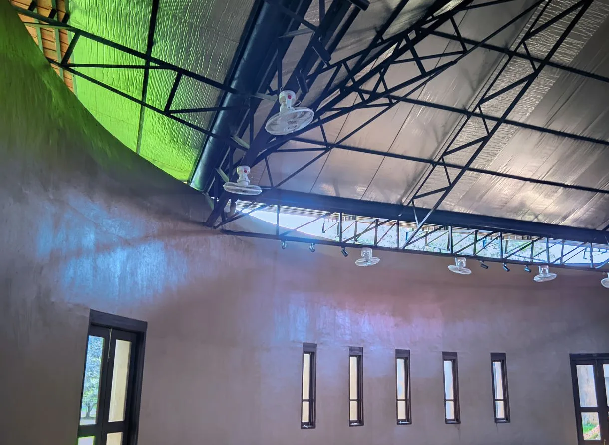 Conference room with large windows overlooking greenery at the eco resort