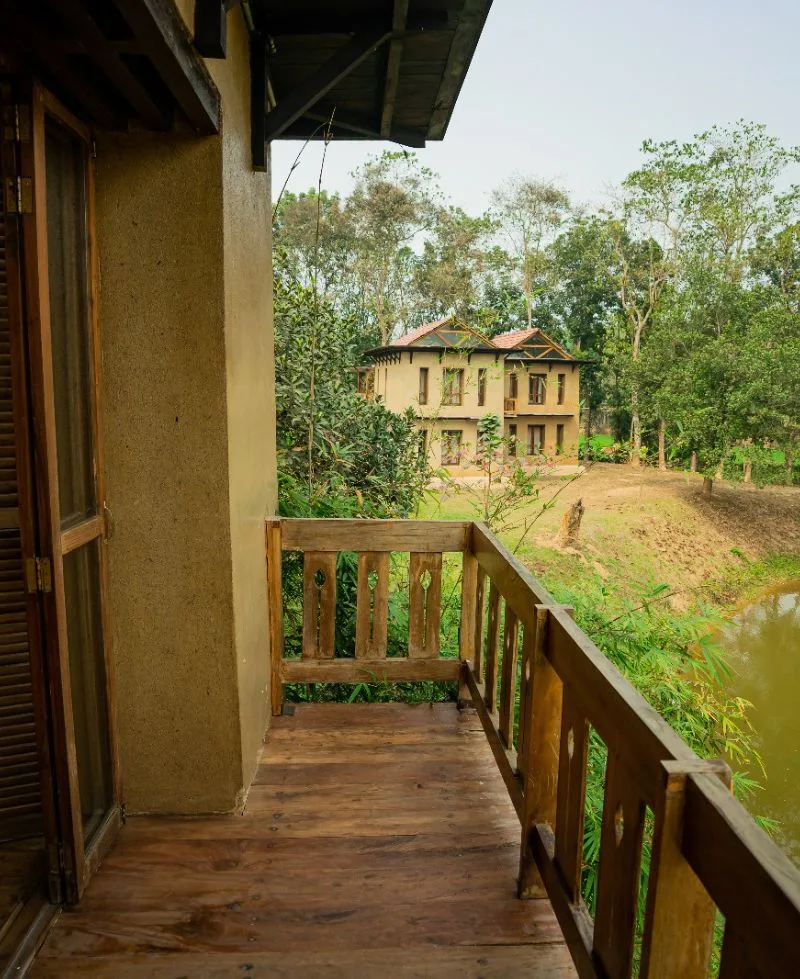 Premium room balcony overlooking the mud villas at the eco resort in Gazipur